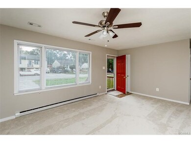 Family room with new paint and carpet!