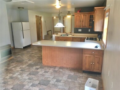 Rich oak cabinets in the open kitchen