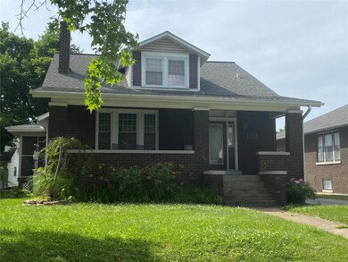 This classic brick bungalow offers a remodeled kitchen and remodeled baths.