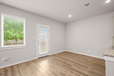 Spare room with light wood-style floors, baseboar