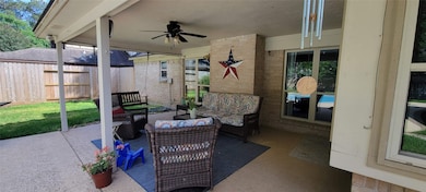 What a great covered patio complete with ceiling fan!