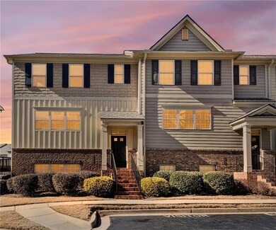 View of property featuring board and batten siding and brick siding