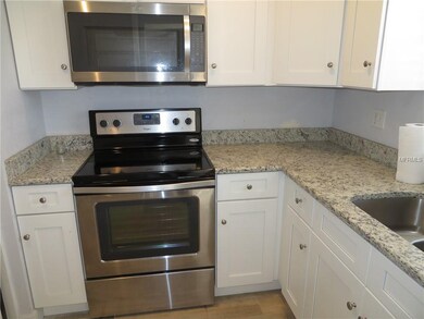 Kitchen with Granite counter tops and Stainless St
