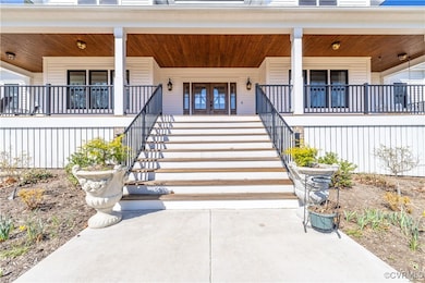 Property entrance featuring covered porch