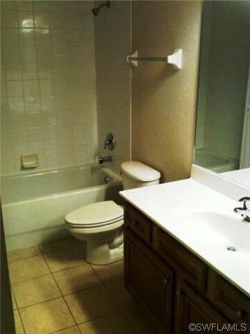 Guest bathroom has large vanity and large closet w