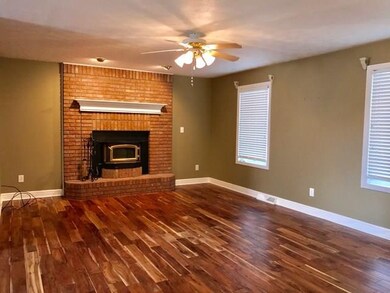 Great room with brick floor to ceiling fireplace a