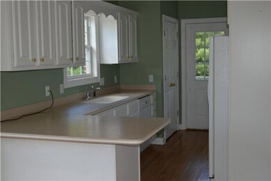 Beautiful 16x10 kitchen with a bar area for additional setting.