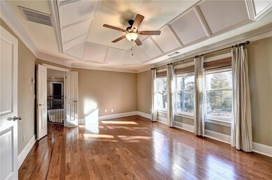 Empty room with baseboards, ceiling fan, and visib