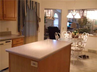 The kitchen flows to the Family Room