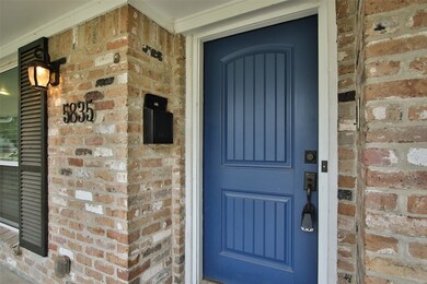Enter through the stylish blue front door!