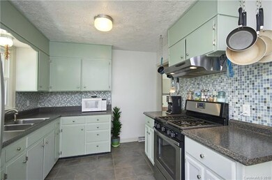 Spacious kitchen with gas stove.