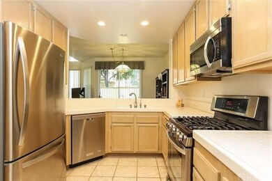 The large kitchen offers upgraded appliances, plen