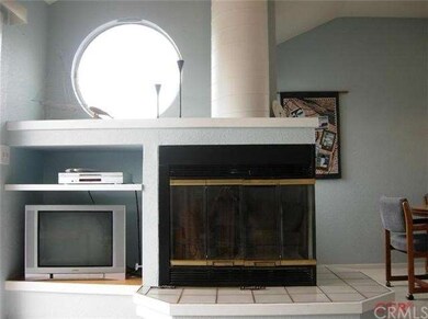 Wood burning fireplace, built ins and windows to t