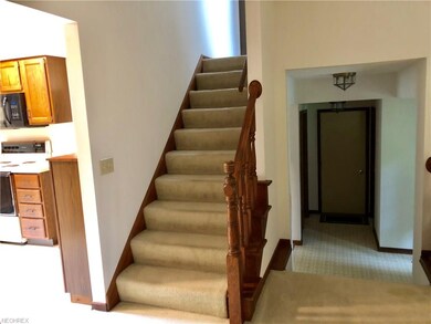Steps go up for 3 beds and 2 full baths; steps go 