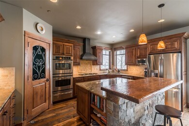 Kitchen over looks the open space and dining room.
