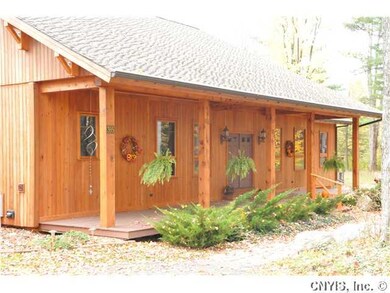 Exterior Front. Large front porch, triple pane win