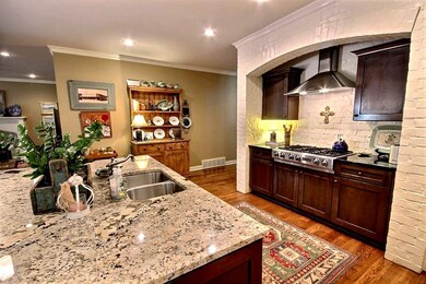 Kitchen with Jenn air gas cooktop & Brick surround