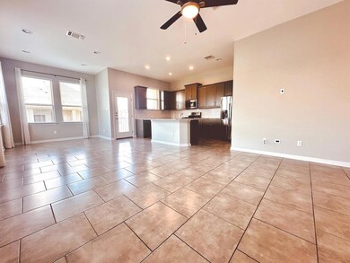 Kitchen featuring open floor plan, stainless stee