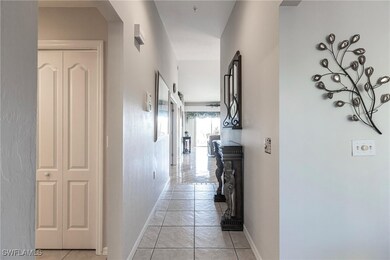Hall featuring light tile patterned flooring