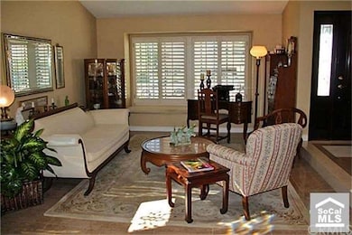 Stunning living room has a built-in window seat, p