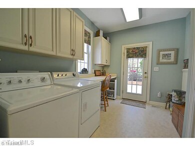 Laundry Room. New Addition that could double into a Craft Room as well. Has Separate Entrance that leads out to the patio and Garden area.
