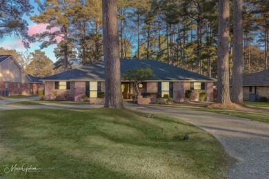 Single story home featuring a large front yard and