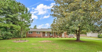 View of front facade featuring a front yard