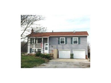 Country Charmer! Lots to offer in this raised ranc