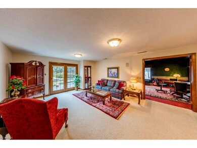 Family room with walkout access to brick paver pat