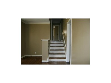 Stairs to 3 bedrooms.