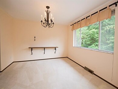 The dining room also has hardwood flooring under t