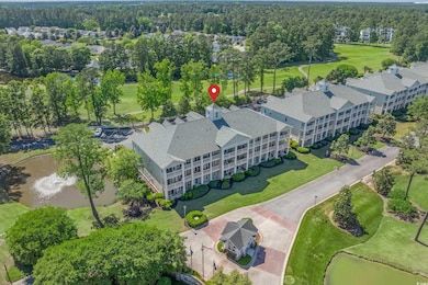 Bird's eye view with a water view and view of golf course