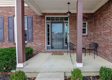 Welcome Home! Front entrance with covered patio, perfect for sitting outside enjoying the Indiana weather. 