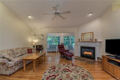 Great Room with gas log fireplace & vaulted ceilin