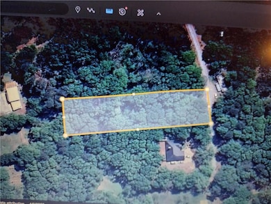 Aerial view of property and surrounding area with property parcel outlined