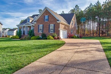 Side entry garage with aggregate drive, sidewalk a