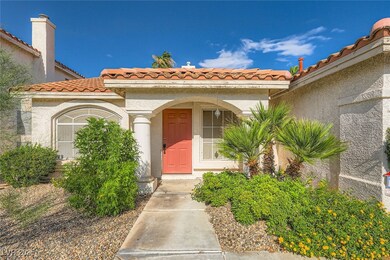 Entrance to property featuring a tiled roof and st