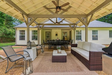 Stunning Pergola with ceiling fans - Outdoor living made easy—coffee, cocktails, or a good book welcome.