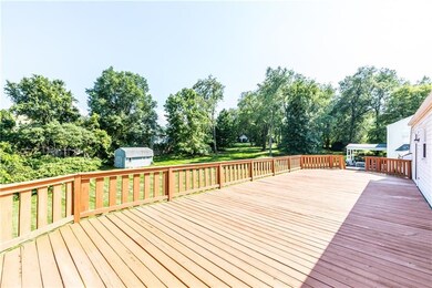 Newly-stained, massive deck overlooking large back