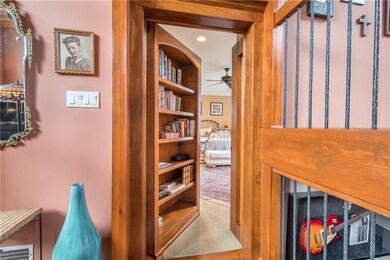 Bookcase entrance to the first floor Master Suite.
