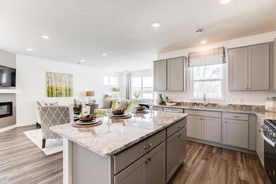 Large windows in this open concept design letting natural light in  - Photos are of model home, colors and finishes may vary