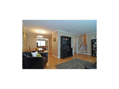 Living room opens to dining area