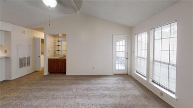Unfurnished living room featuring light colored c