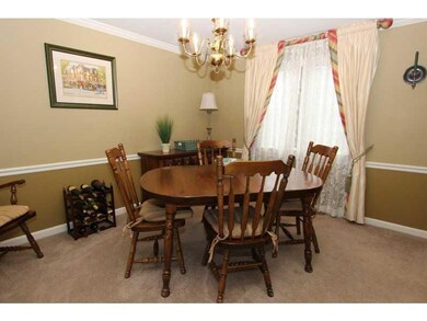 Dining Room. The dining room features crown moldin