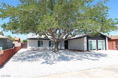 View of front of house featuring a gate and stucco