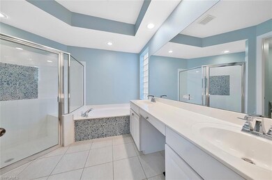Bathroom featuring vanity, tile patterned floors, 