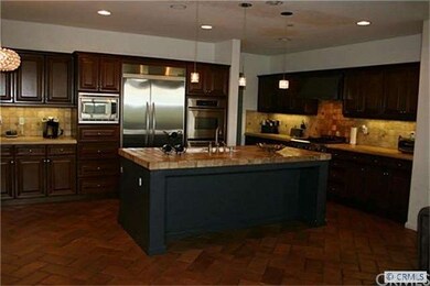 Kitchen with Granite limestone & tumbled stone cou