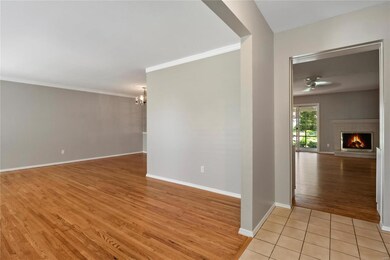 View from Entry Foyer into the house - L-shaped Living Room/Dining Room on the Left, Family Room straight ahead
