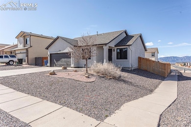 View of front of property with a shingled roof, fe