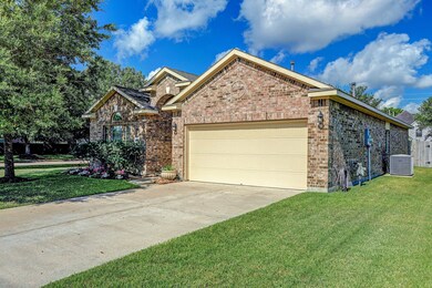 Side Profile Of Home With Double Wide Driveway & Double Car Garage.